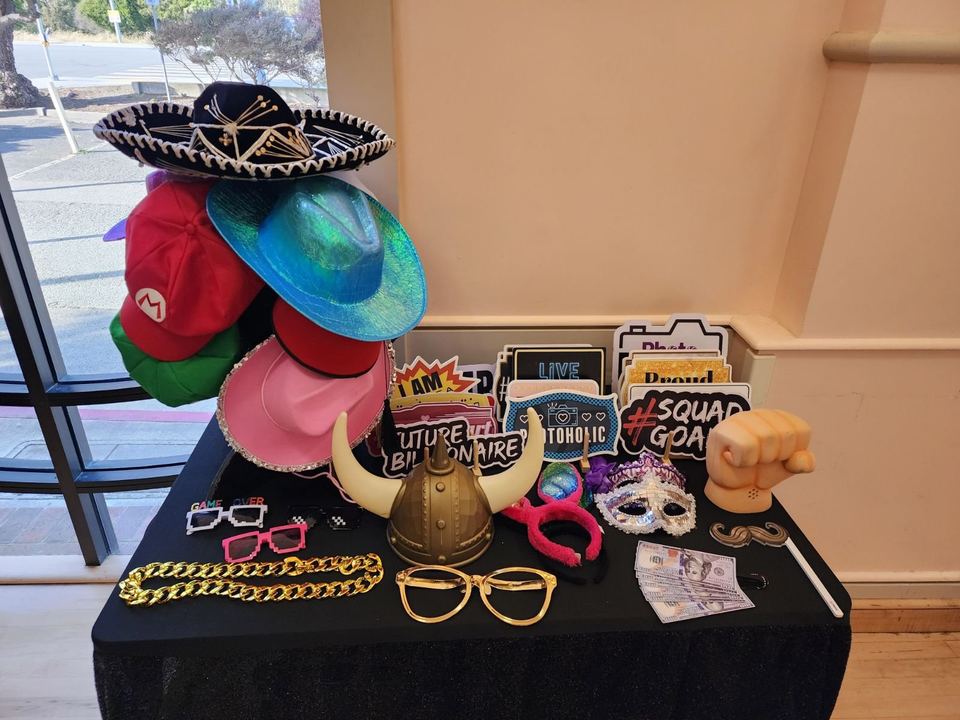 Table of hats, glasses and sign props